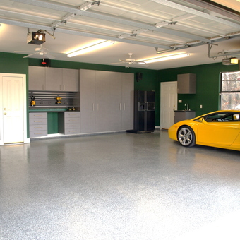 Modern garage with storage cabinets and yellow car - TXbully from Argyle, TX