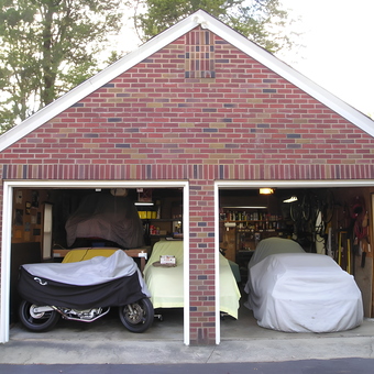 Organized two-car brick garage with vehicle covers - Bubbleman from Wharton, NJ