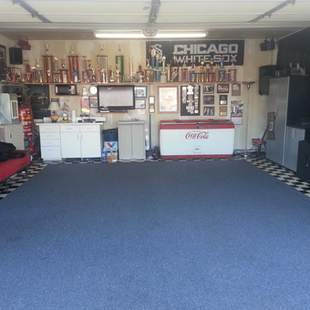 Organized garage with cabinets, tool chests, and decor - Barry from Monee, IL