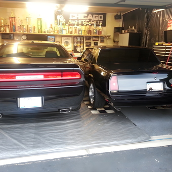 Organized garage with two classic cars and trophy display - Barry from Monee, IL