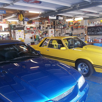 Organized garage with Mustangs, tools, signs, and supplies - Randy from Lebanon, MO