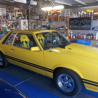 Organized garage with yellow muscle car and racing decor - Randy from Lebanon, MO