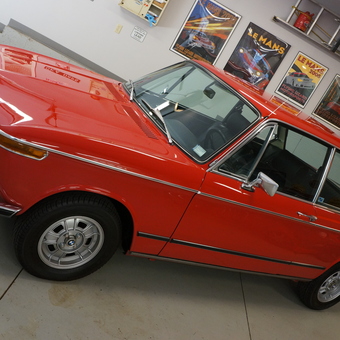 Classic red BMW in decorated garage with posters - BradB from St. Louis, MO