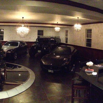 Luxury Garage With Classic Cars, Bar, and Chandeliers - Anonymous