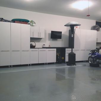 Modern Garage with White Cabinets and Bike - Nezz from Chagrin Falls, OH