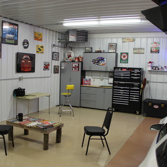 Organized garage with tool cabinets and wall decor - The Toy Box from Rochester, IN