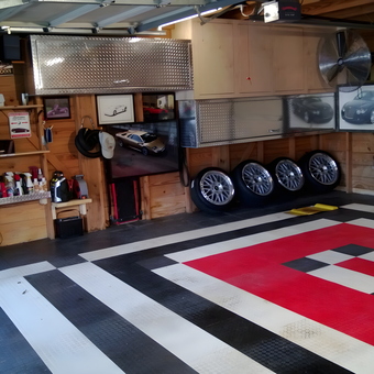Custom garage flooring, storage cabinets, and wall decor - Mario from Houston, TX