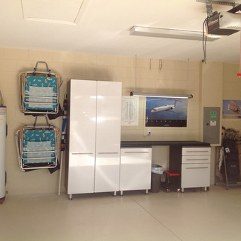 Organized garage with cabinets, tool storage, and wall racks - Marty from Winter Haven, FL