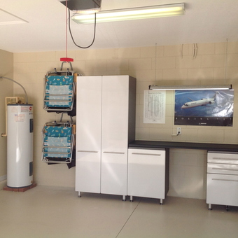 Modern garage with white cabinets and storage racks - Marty from Winter Haven, FL