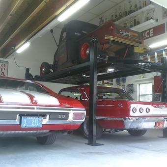 Classic Red Cars and Four Post Lift in Garage - Scatman from Guyton, GA