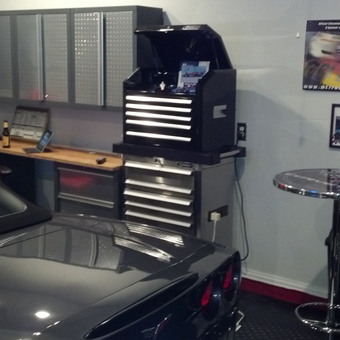 Modern garage with tool cabinets, bar table, and car - Jim from McKinney, TX