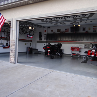 Organized garage with motorcycles, cabinets, and tool storage - Dan from Brighton, CO