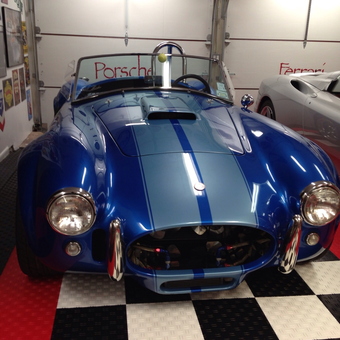 Classic Car on Checkerboard Garage Flooring - Flooring