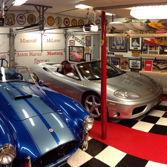 Classic Car Garage with Checkered Flooring and Vintage Decor - Flooring