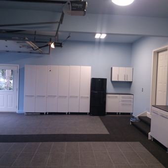 Modern Garage with White Cabinets and Black Fridge - ReMarkable ReModeling from Rocky Hill, CT