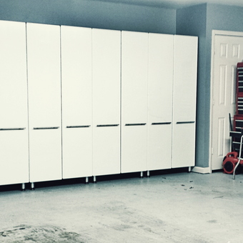 Modern garage with white cabinets and red tool chests - David from Tulsa, OK