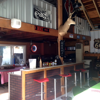 Garage Bar with Retro Stools and Wall Signs - Trouble from Grosse pointe park, MI