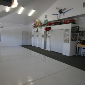 Organized garage with wall decor and workbench - Dan from Chandler, AZ