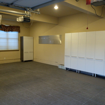 Modern Garage With White Cabinets and Tile Floor - ReMarkable ReModeling from Rocky Hill, CT