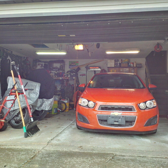 Organized Garage with Tools, Orange Car, and Bikes - Mike from Painesville, OH