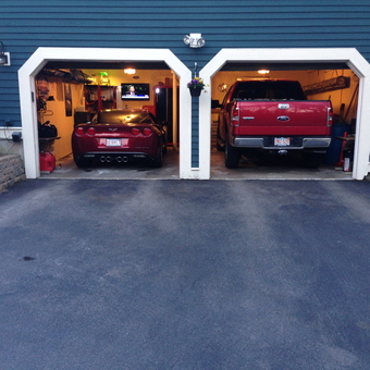Two-Car Garage With Red Vehicles and Wall Storage - Gary from Dudley, MA