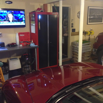 Organized garage with red cabinets and workbench - Gary from Dudley, MA