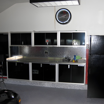 Modern garage with black cabinets and diamond plate backsplash - Rick from Tyngsboro, MA