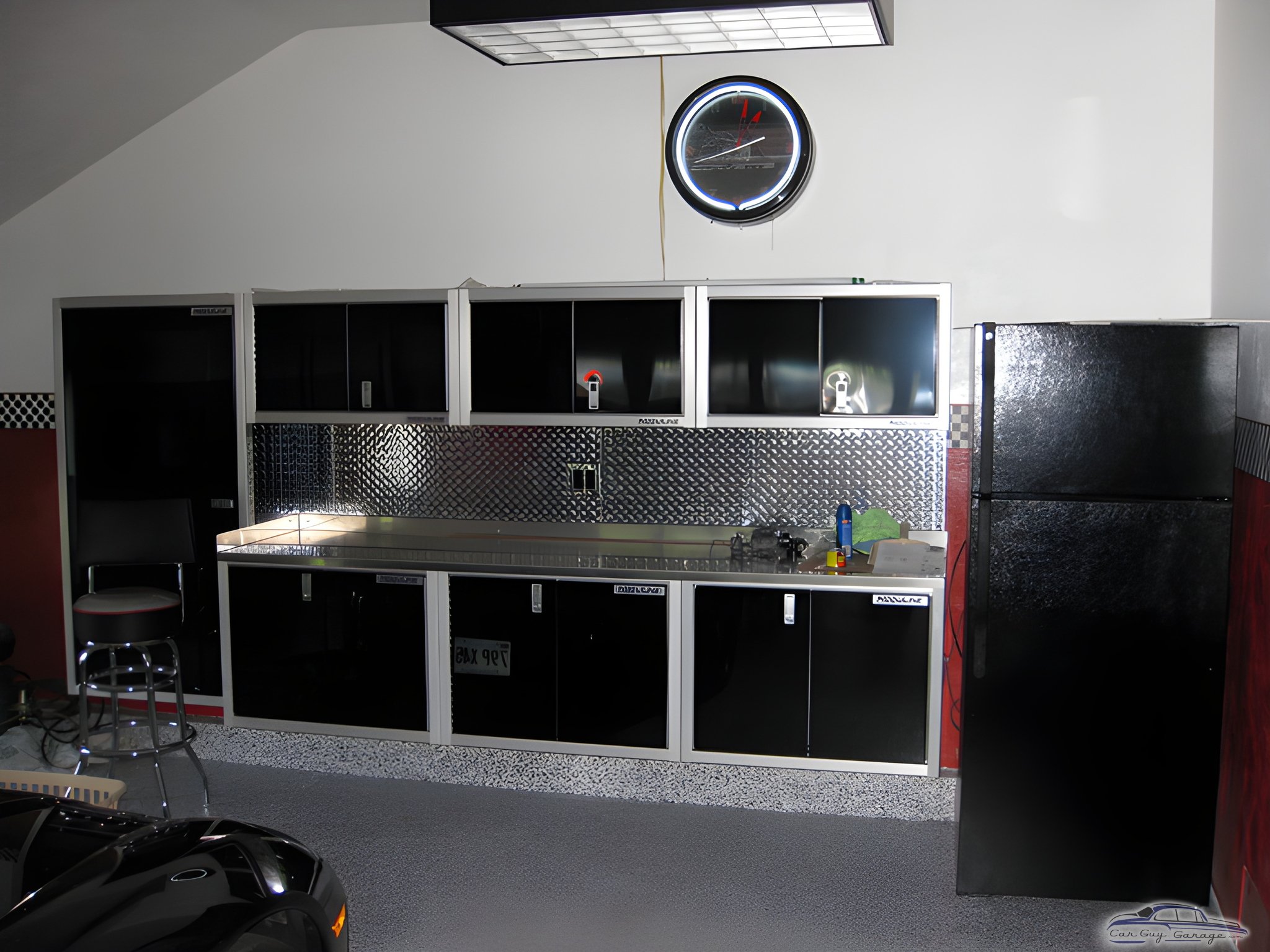 Modern garage with black cabinets and diamond plate backsplash - Rick from Tyngsboro, MA