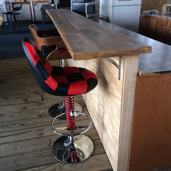 Garage bar with racing bar stools and wood counter - Hardy from Trophy Club, TX
