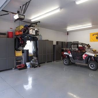 Organized garage with cabinets, storage, workbench, and UTV - WyoNative from Casper, WY