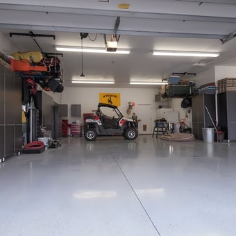 Organized garage with storage cabinets and UTV - WyoNative from Casper, WY
