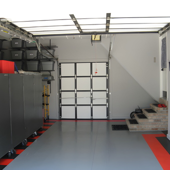 Organized garage with cabinets, bins, and flooring - Gil from Chicago, IL