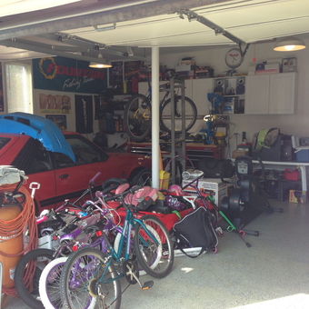 Organized garage with car, bikes, cabinets, and tools - Fullblown garage from Brick, NJ