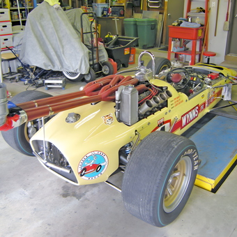 Vintage Indy race car with custom exhaust in garage - OldCarMan from Ortonville, MI
