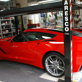Organized Garage with Car Lift, Tool Storage, and Red Corvette - Jerry Carguy from Pinckney, MI