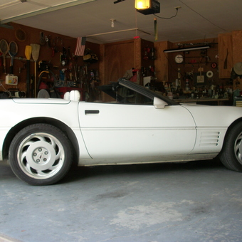 Organized garage with white convertible and tool storage - KBadA25405 from Bartlesville, OK