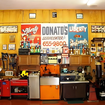 Organized garage with tool chests, cabinets, and wall decor - Frank from Finksburg, MD