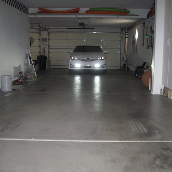 Spacious garage with cabinets and parked car - Not So Fast from lake havasu city, AZ