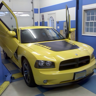 Yellow Dodge Charger on Car Lift with Lambo Doors - Erik from Clarks summit, PA