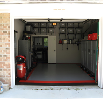Organized garage with cabinets, storage bins, and flooring - Gil from Chicago, IL