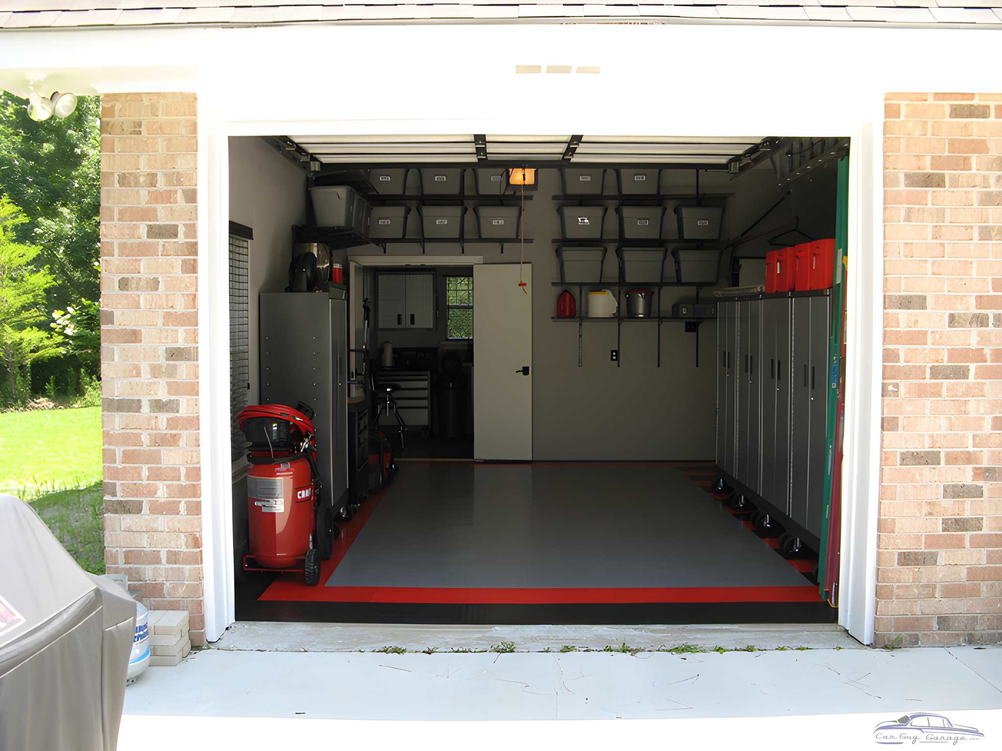 Organized garage with cabinets, storage bins, and flooring - Gil from Chicago, IL