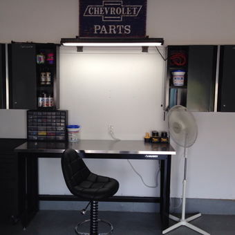 Organized garage workspace with Husky cabinets and stool - Sikes44 from Shawnee, KS