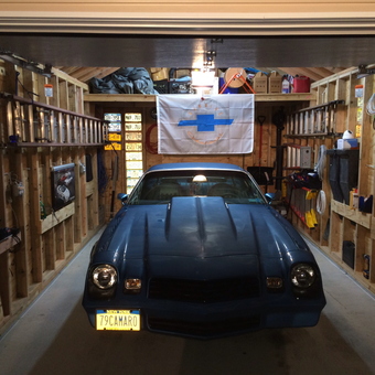 Organized garage with tools, ladders, and 1979 Camaro - CaMaRo 1979 from Ozone park, NY