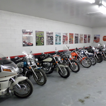 Motorcycle Collection and Vintage Wall Art Display - Ron's Toy Box