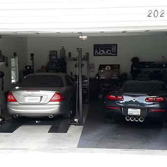 Organized two-car garage with car lift and tools - Jason from Kingston, TN