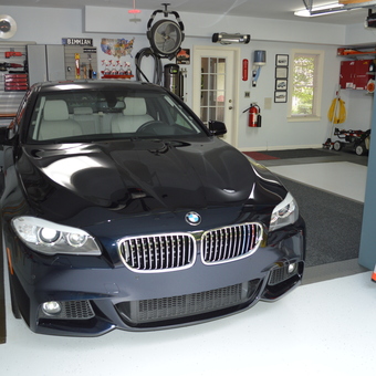 Organized garage with cabinets, tool chests, and BMW - David Low from Kennesaw, GA