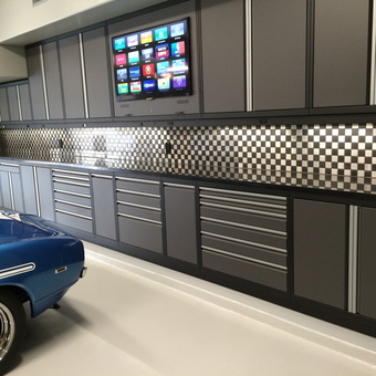 Modern garage cabinets and checkered backsplash - Speedy's Garage from Friendswood, TX