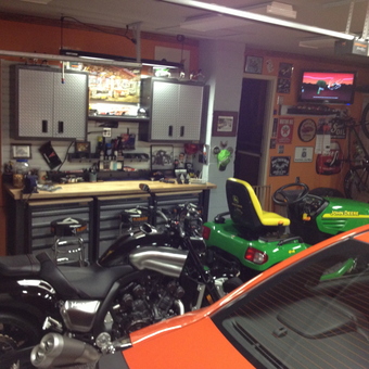 Organized garage with cabinets, tool chests, and vehicles - Madmax from Granger, IN