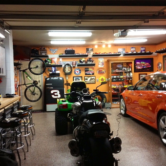 Organized garage with car, bikes, bar stools, and cabinets - Madmax from Granger, IN