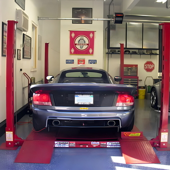 Home garage with car lift, tool chest, and wall decor - Craig C from Westbrook, CT